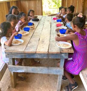 Children at Belen Moravian eating food provided through a grant from the Moravian Hunger & Thirst Field of Interest Fund.