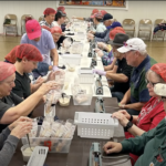 Church Collaboration: Addressing Hunger and Thirst through Meal Packaging