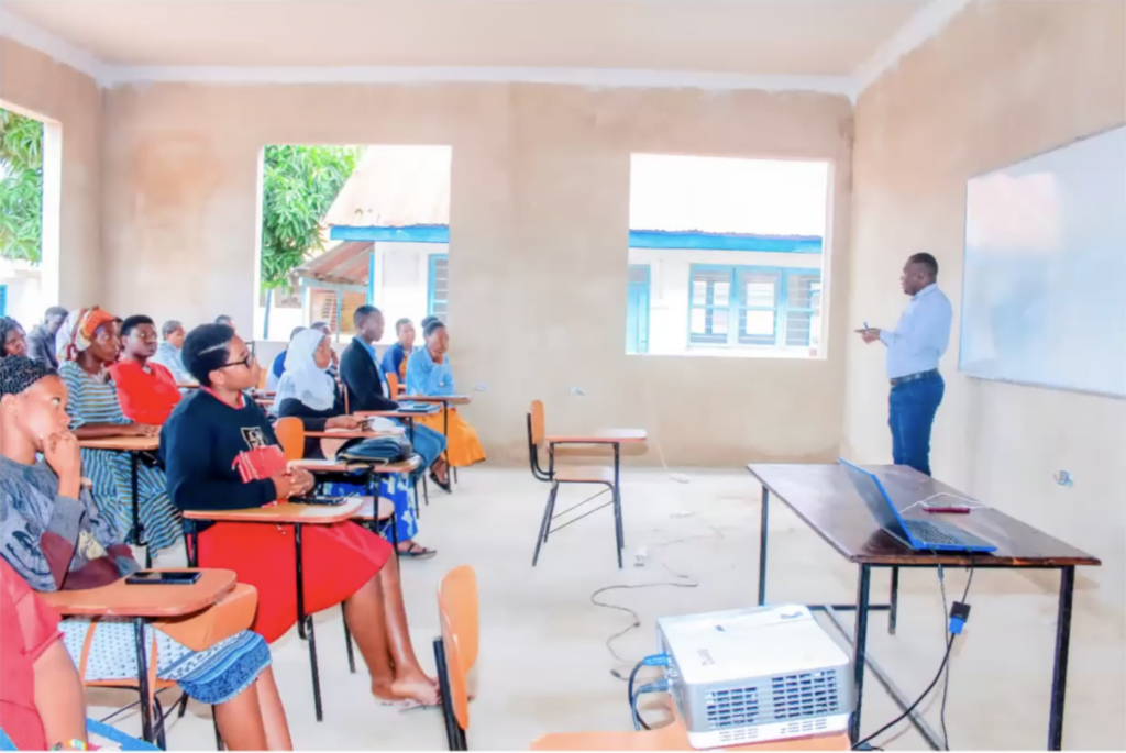 Students at the Comenius Polytechnic Institute in Tabora, Tanzania attend class in a newly-constructed classroom.